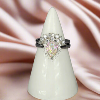 The Alice ashes ring, with rainbow leaf background