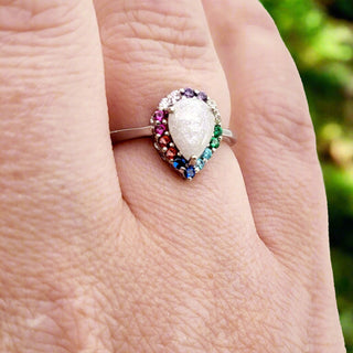 rainbow stones scale on hand
